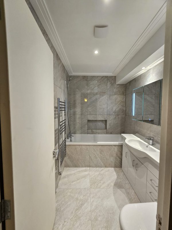 A typical mid-tier (~£9K–£12K) London family bathroom — this is what an honest itemised quote actually buys you.